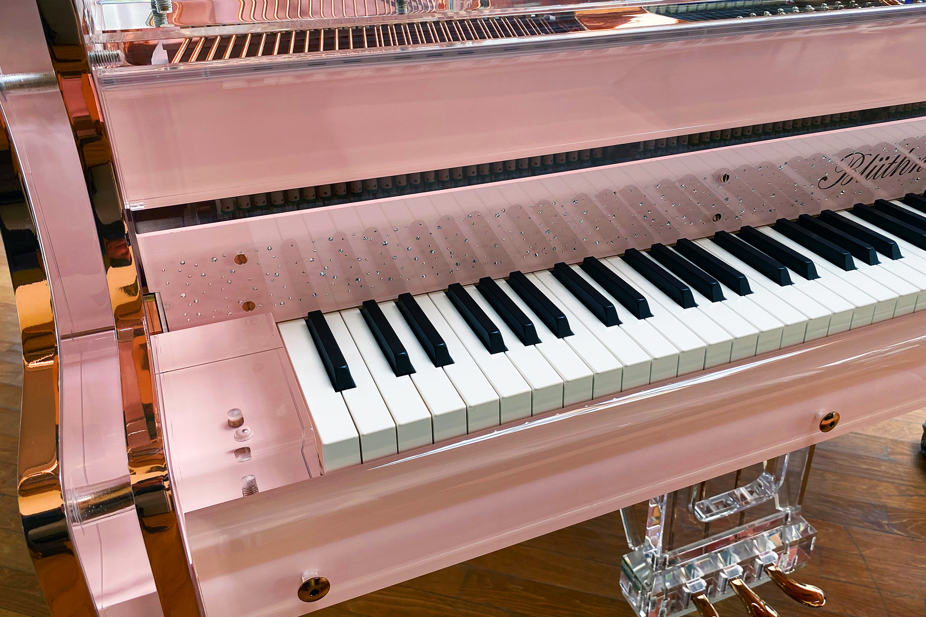 Bespoke piano in pink finish with crystal detailing