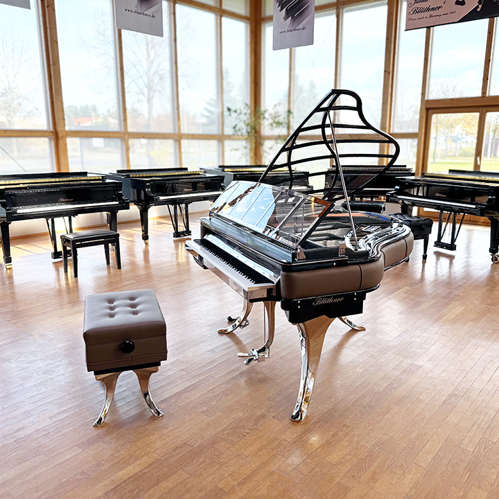 Original Blüthner PH Piano 150cm with brown leather, chrome metal fittings and a black iron frame