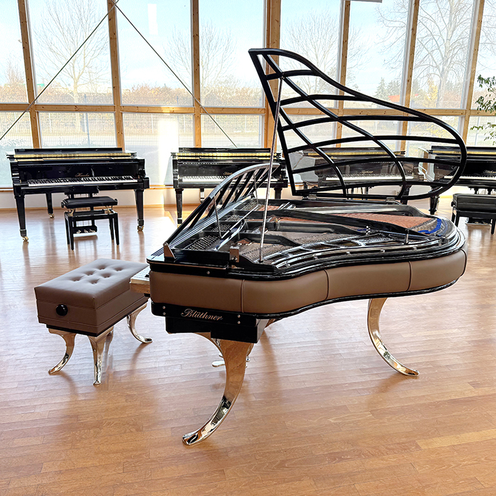 Original Blüthner PH Piano 150cm with brown leather, chrome metal fittings and a black iron frame